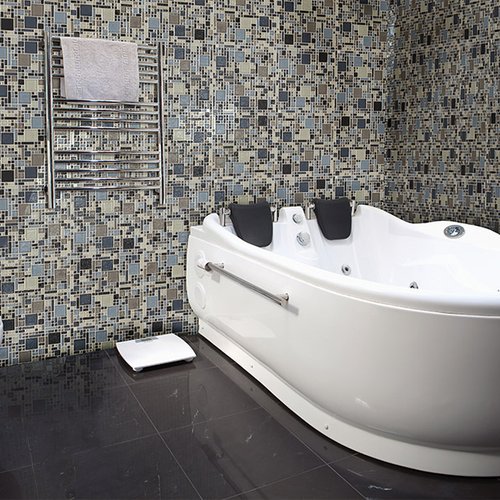 Glass tile bathtub surround in Oak View, CA from Chisum's Floor Covering