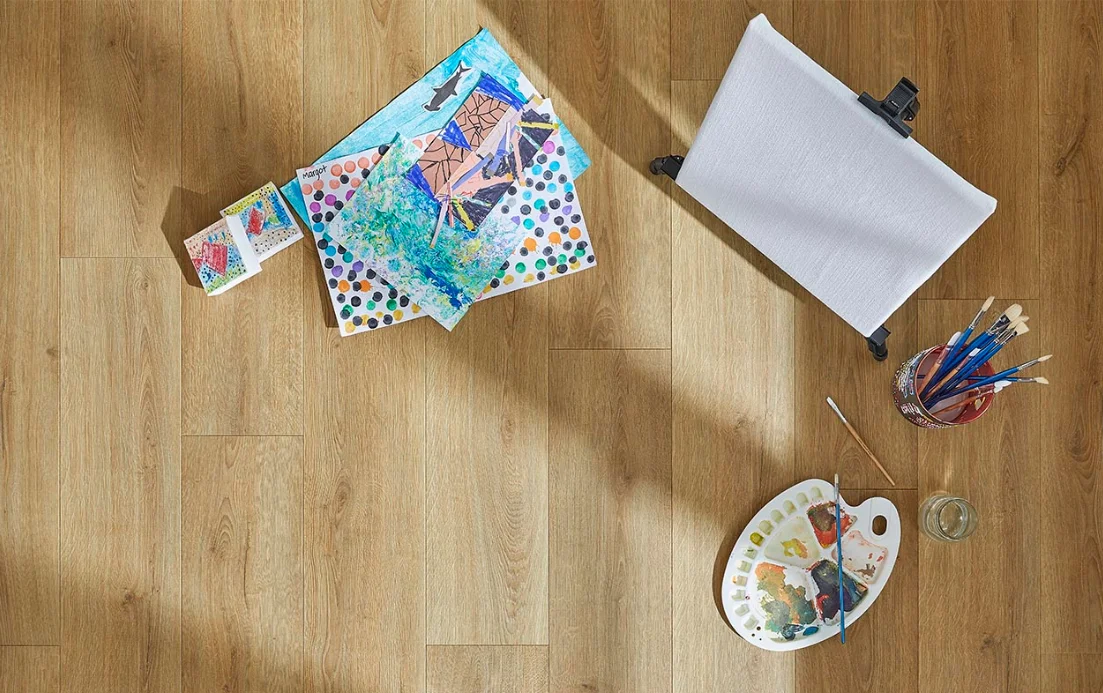 Art supplies on a laminate floor